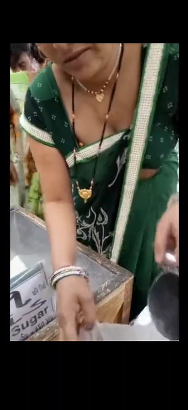 Desi milf awesome cleavage and boobs closeup in supermarket