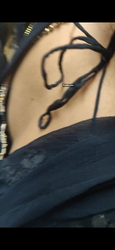 Desi woman bare back and black bra visible from top