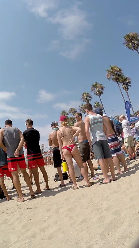 Plump round ass closeup caught by voyeur on beach (HD)