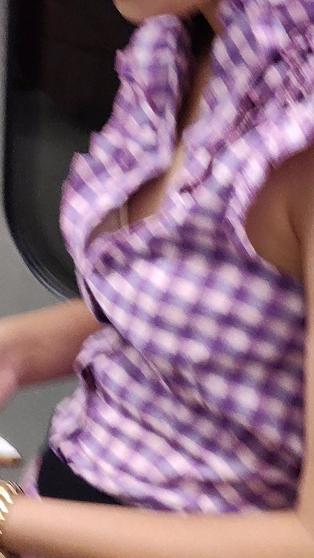 Young lady designer bra visible clearly through open shirt