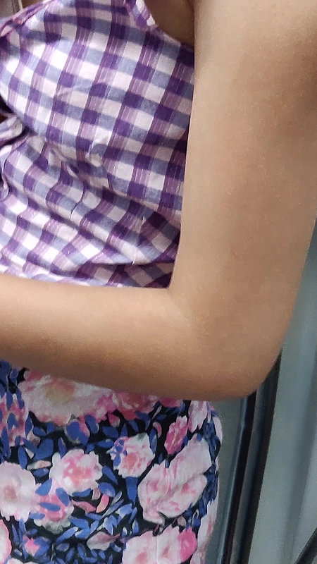 Young lady designer bra visible clearly through open shirt