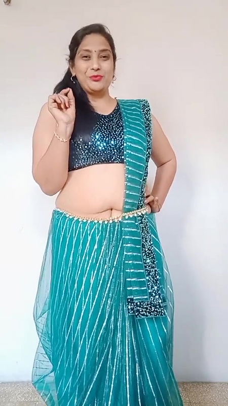 kruti Patel with net saree drapping with waist cha.