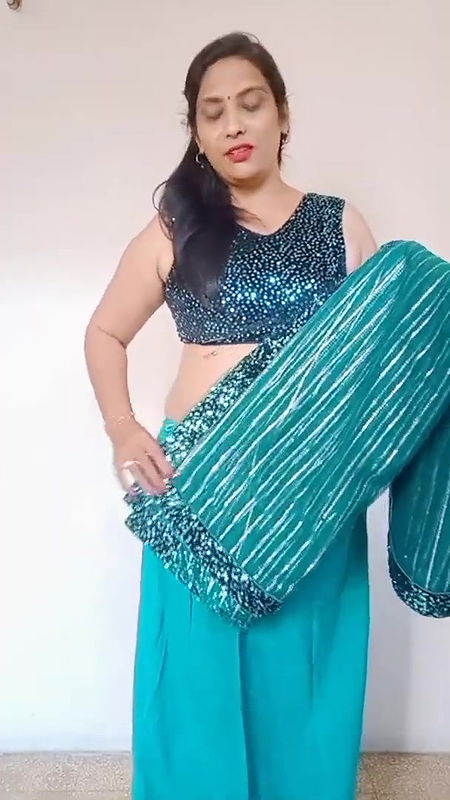 kruti Patel with net saree drapping with waist cha.
