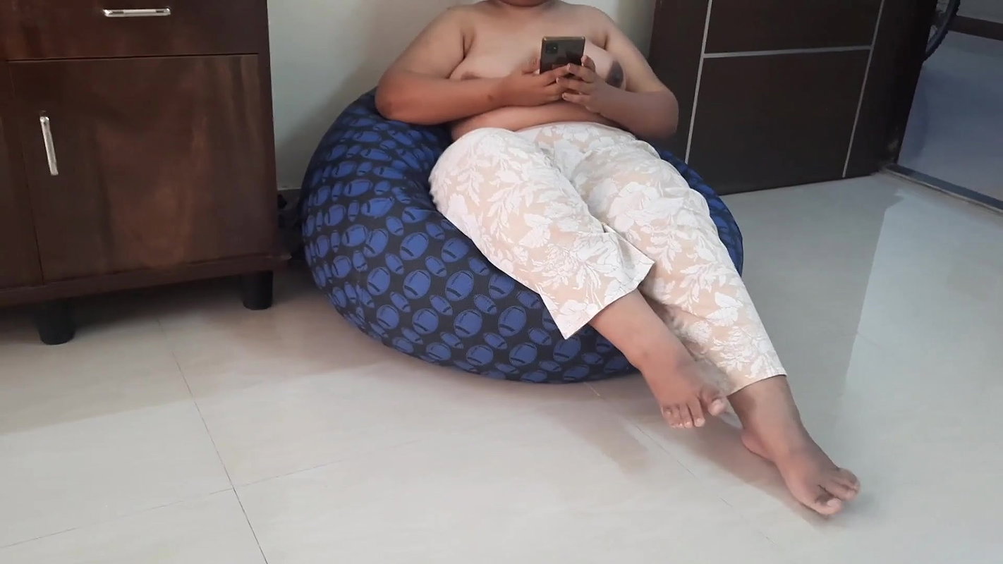Indian wife sitting topless with the door open.