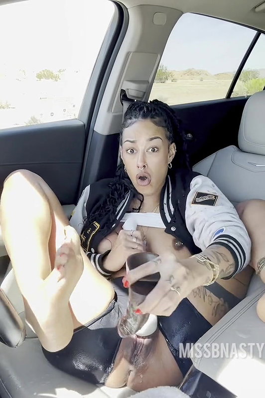 Hot ebony cam girl dildoing pussy and super squirting in a car