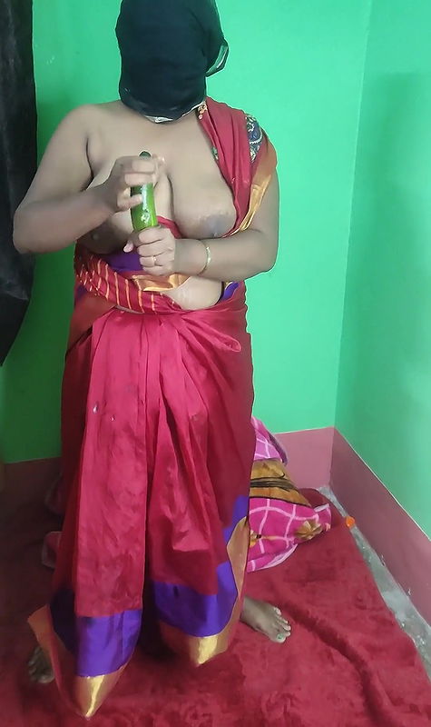Desi Bengali boudi Strips in sharee and fucking with cucumber.