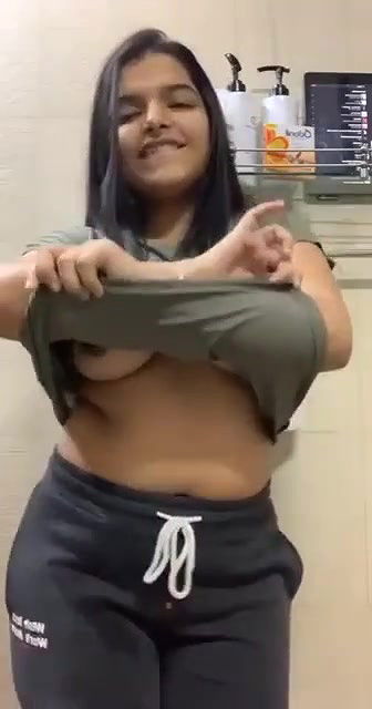 Sexy tanker babe in bathroom