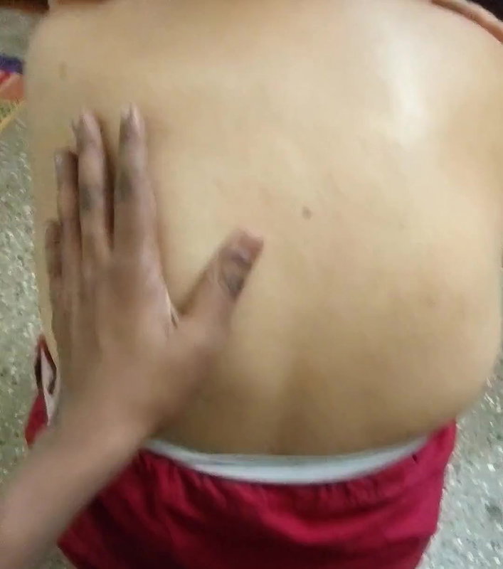 Auntie’s back massaged by her boyfriend.