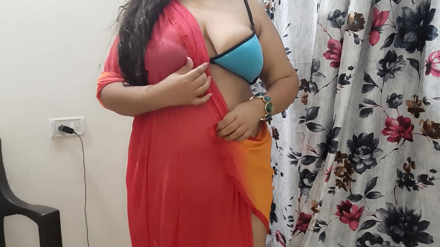 horny desi Indian bhabhi trying on her new clothes in her bedroom.
