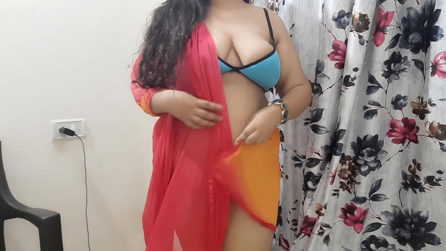 horny desi Indian bhabhi trying on her new clothes in her bedroom.