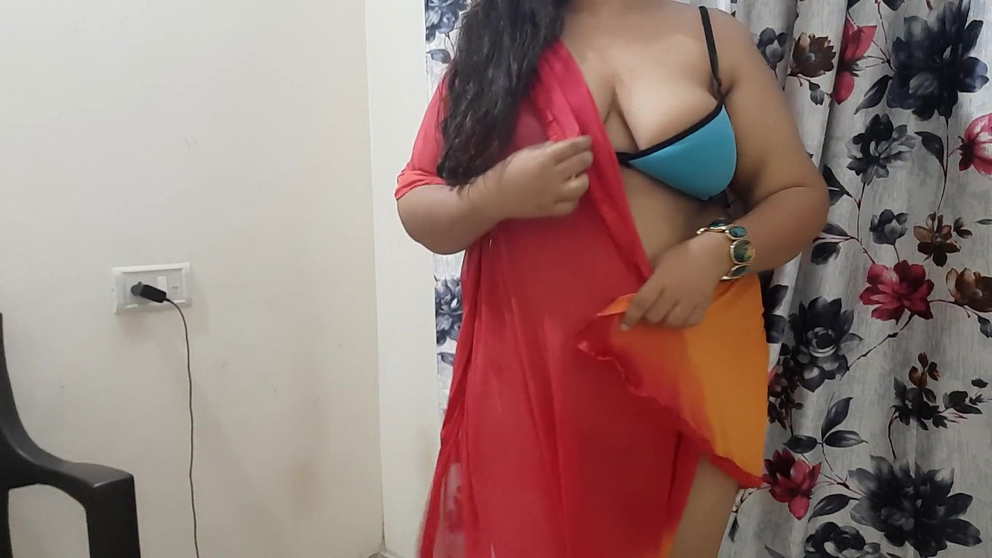 horny desi Indian bhabhi trying on her new clothes in her bedroom.