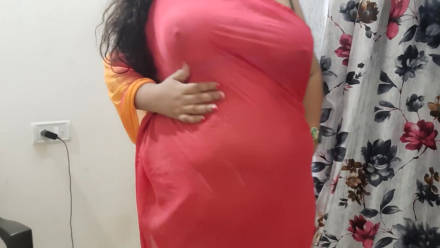 horny desi Indian bhabhi trying on her new clothes in her bedroom.