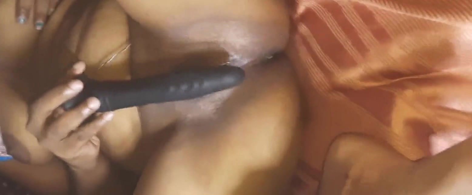 Horny Sri Lankan girl masturbating pussy with Dilido She rubbed her bushy pussy video thrills the sex excitement well.