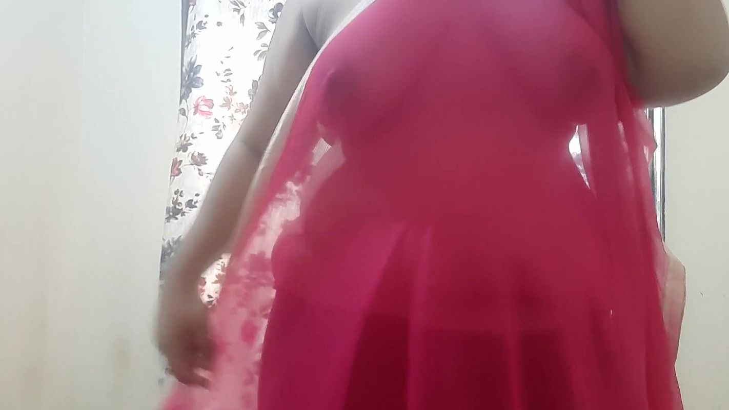 HOT DESI BHABHI IN RED TRNASPARENT SAREE.