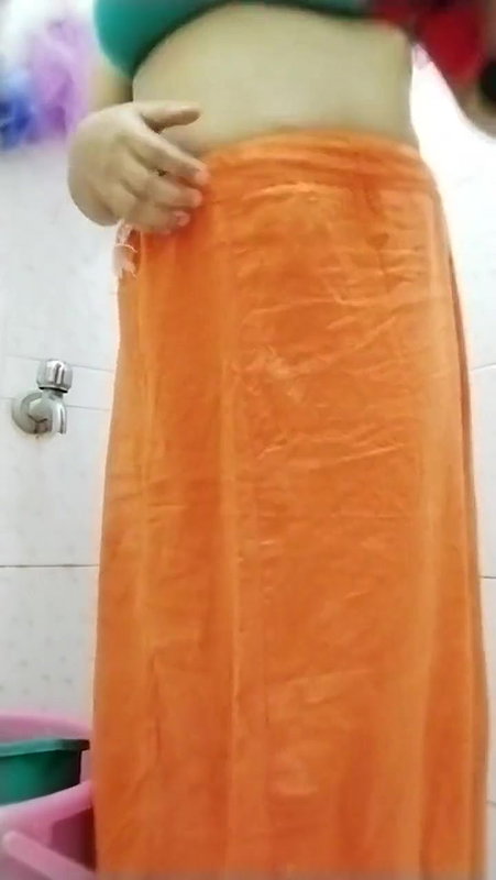 Indian girl pissing, Vaginal discharge and bathing in a video shot by herself.