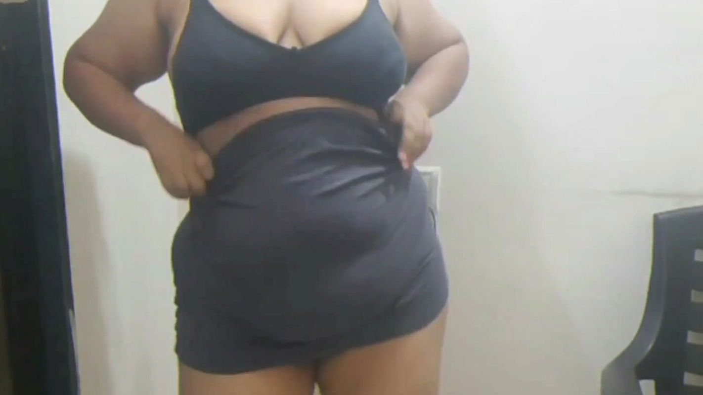 Indian girlfriend teasing her boyfriend with sexy strip show.