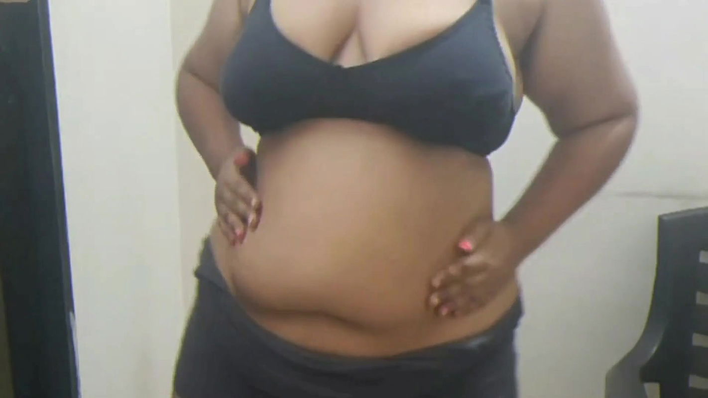 Indian girlfriend teasing her boyfriend with sexy strip show.