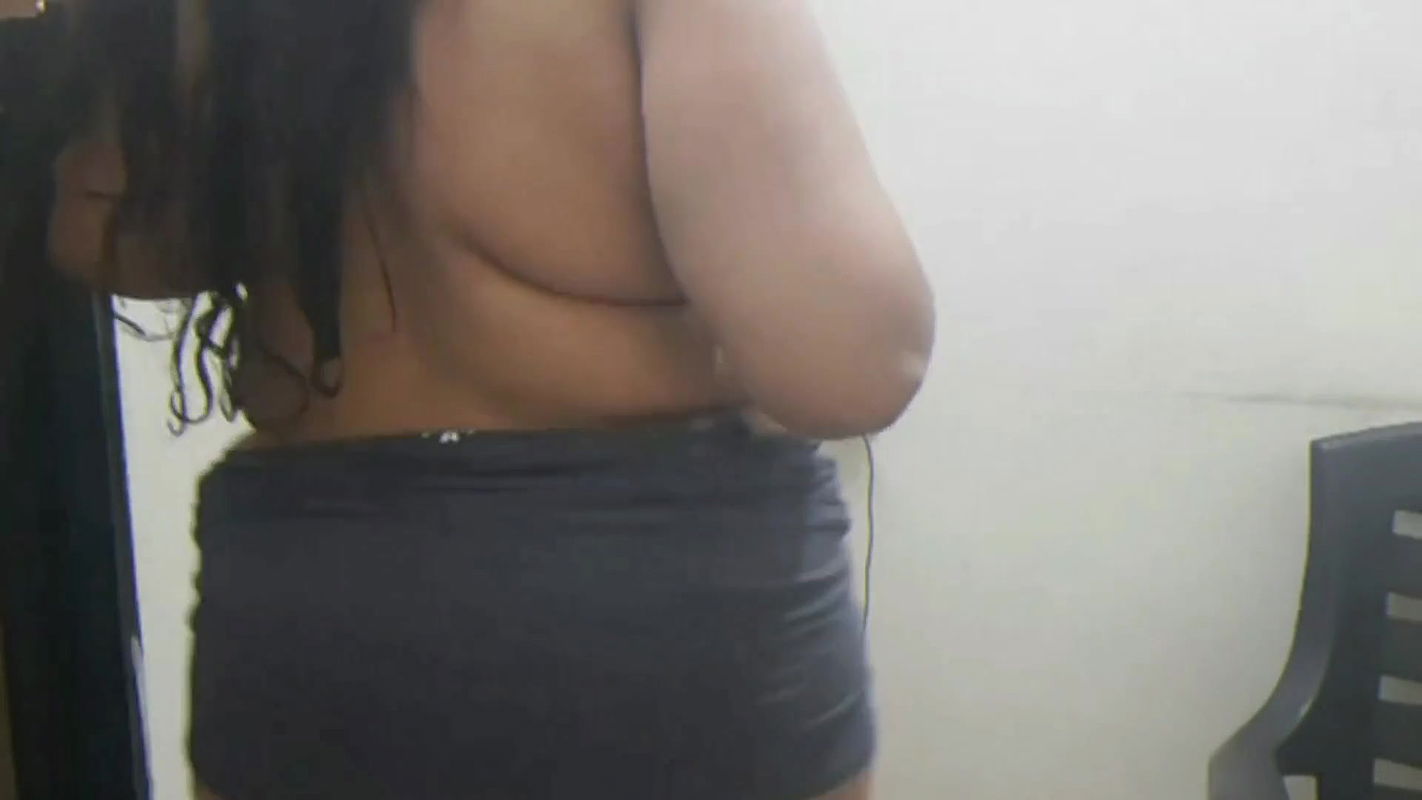 Indian girlfriend teasing her boyfriend with sexy strip show.