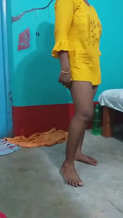 Pampa in a yellow dress.