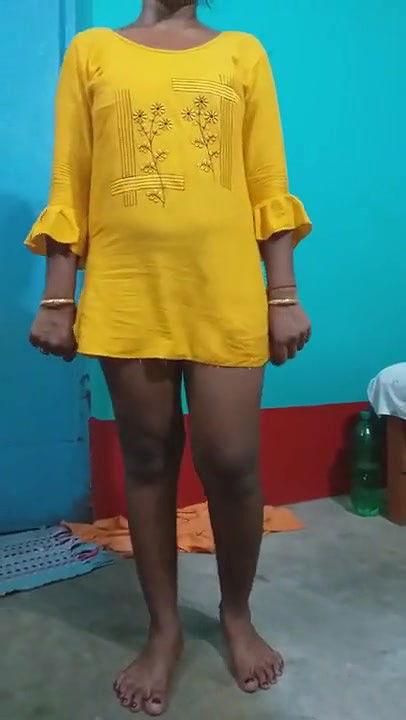 Pampa in a yellow dress.