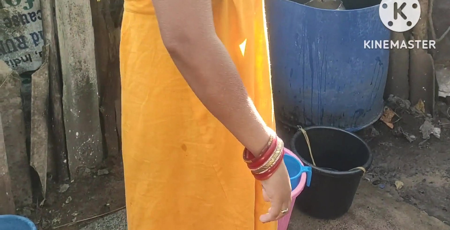 Anita yadav bathing outside with hot.