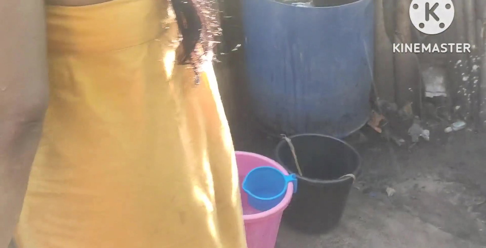 Anita yadav bathing outside with hot.