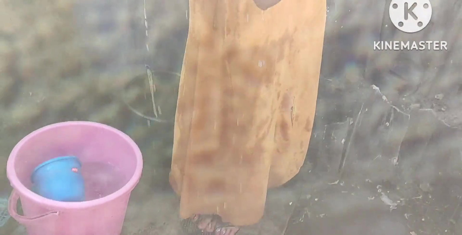 Anita yadav bathing outside with hot.
