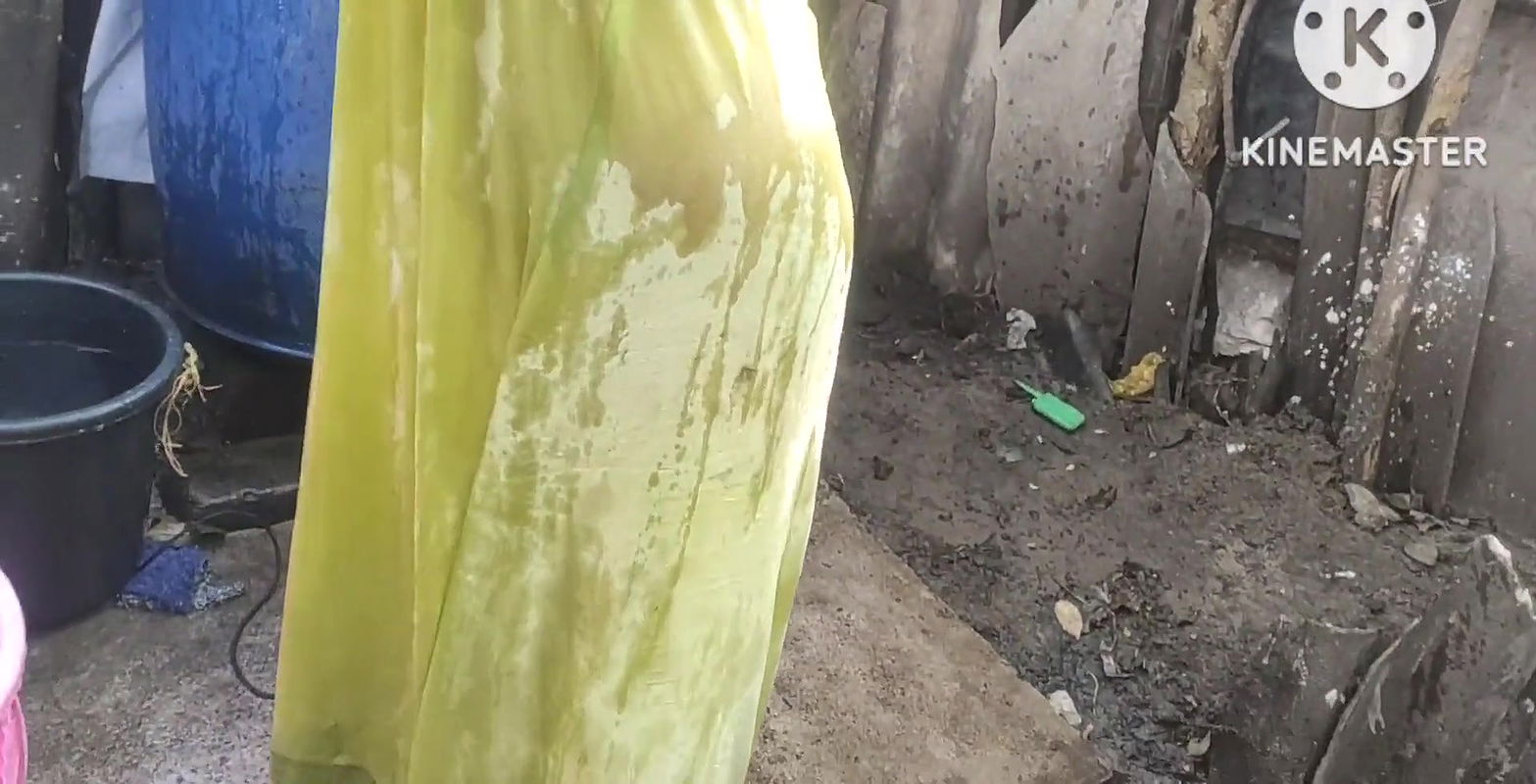 Bathing with cold water topless.