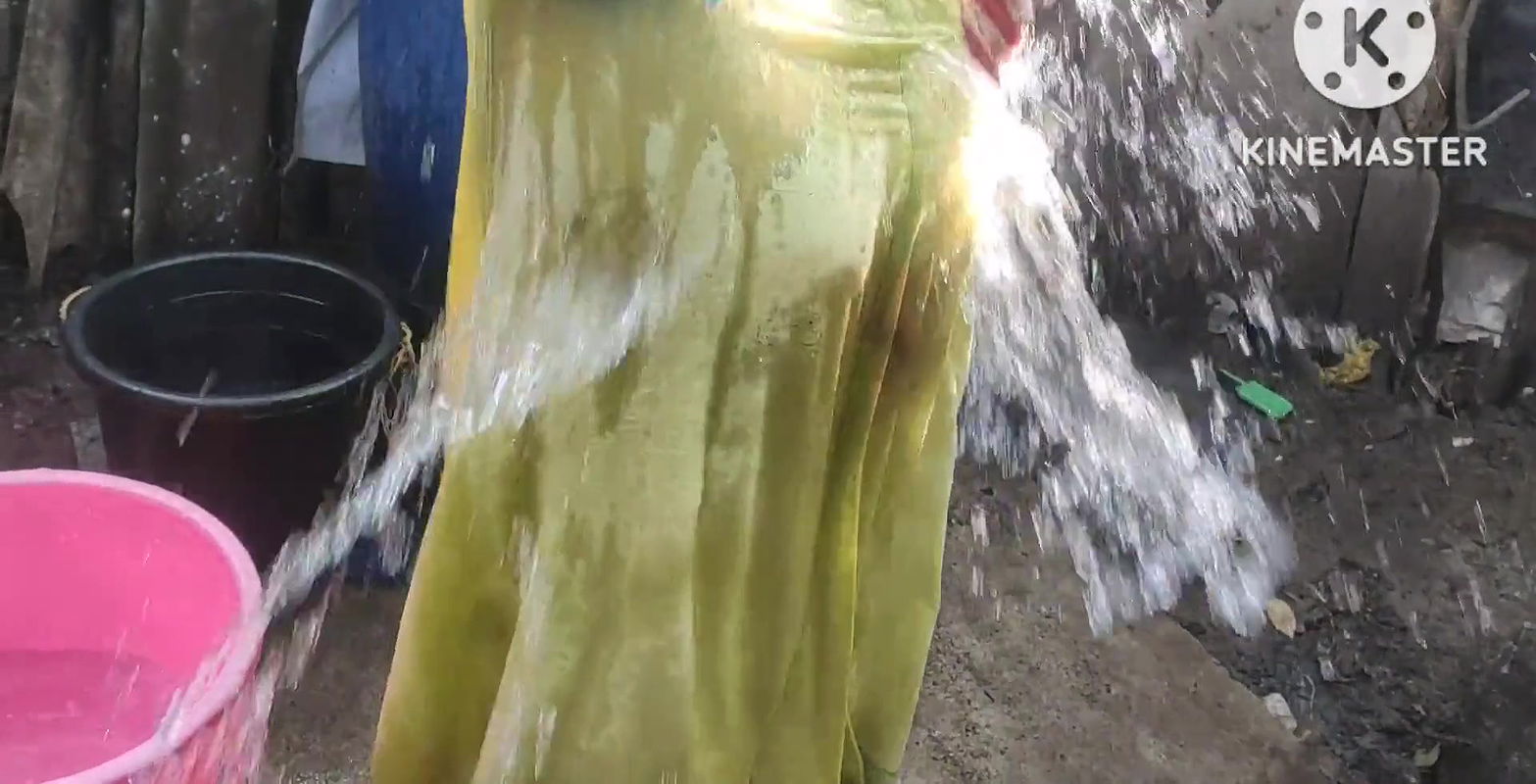 Bathing with cold water topless.