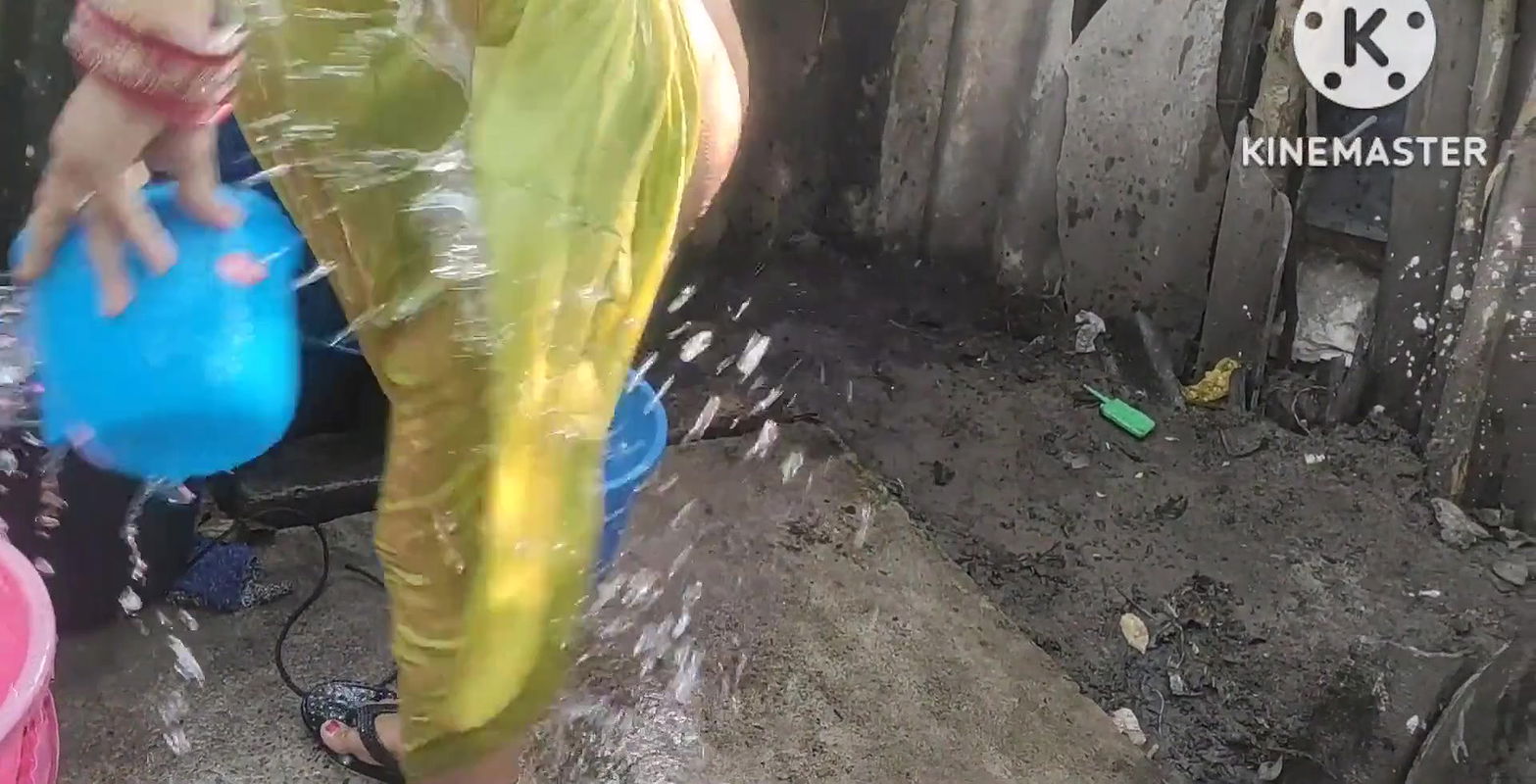 Bathing with cold water topless.