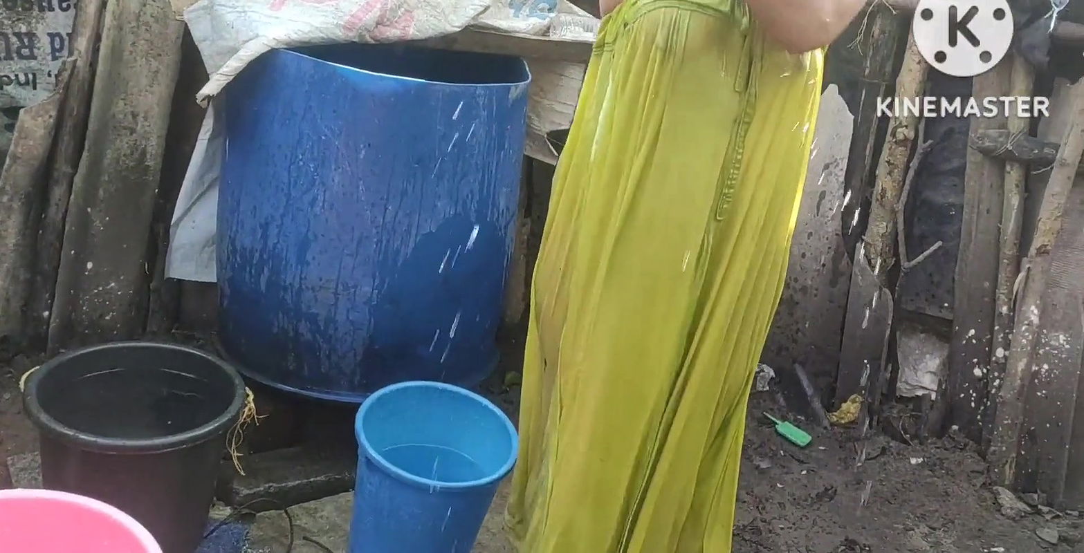 Bathing with cold water topless.