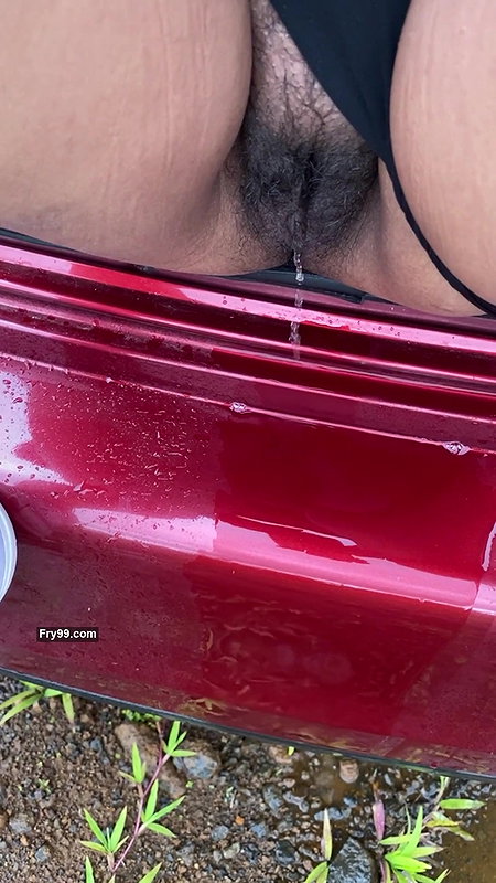 hot girl pissing on the way outside of the car boot.