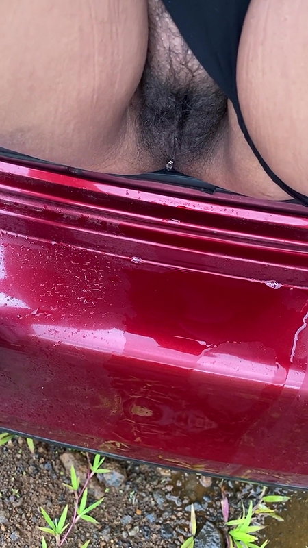hot girl pissing on the way outside of the car boot.