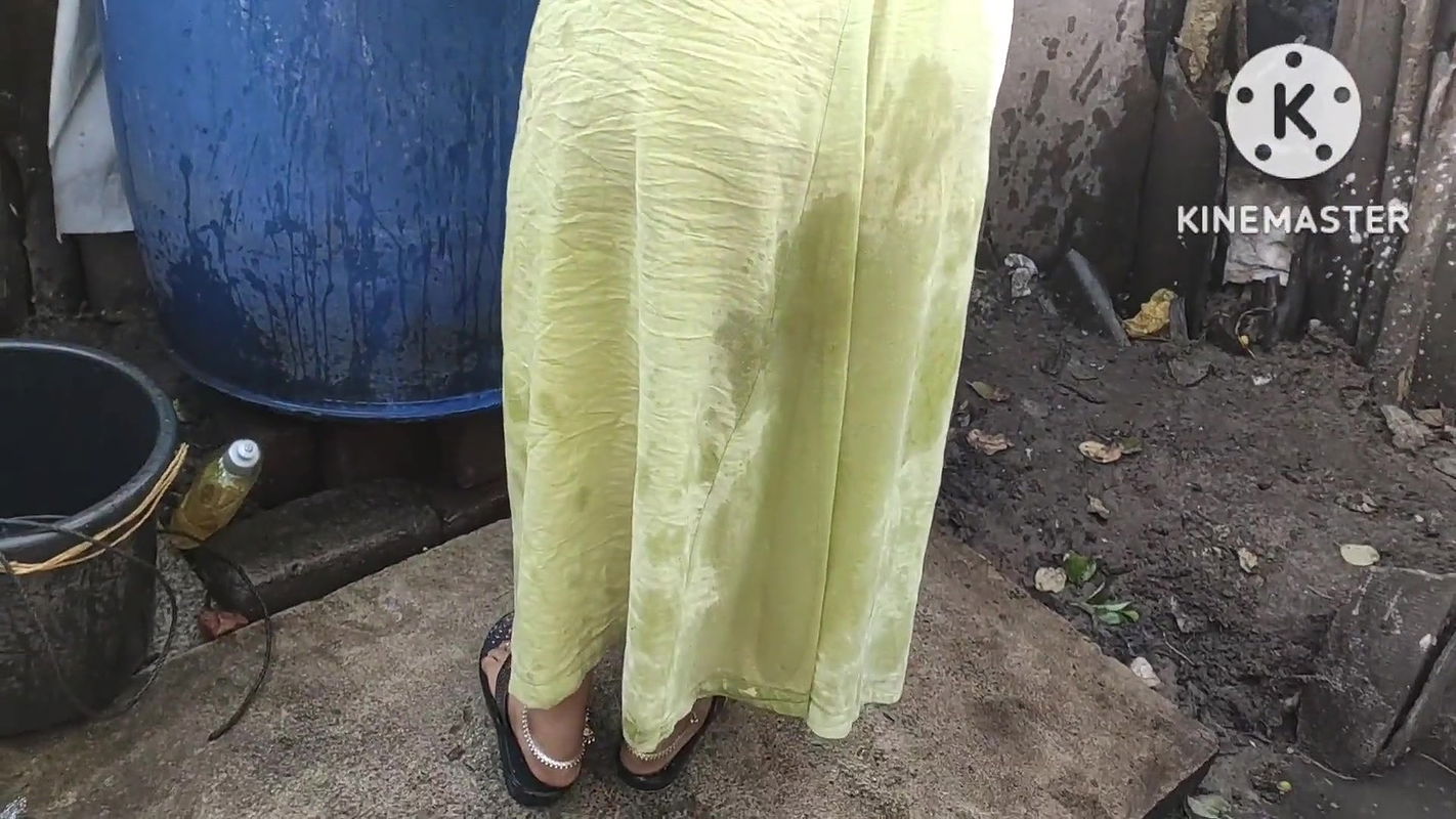 indian housewife bathing outside with dance