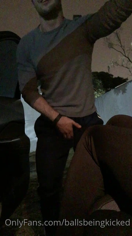 A girl in nature punishes a guy in the balls