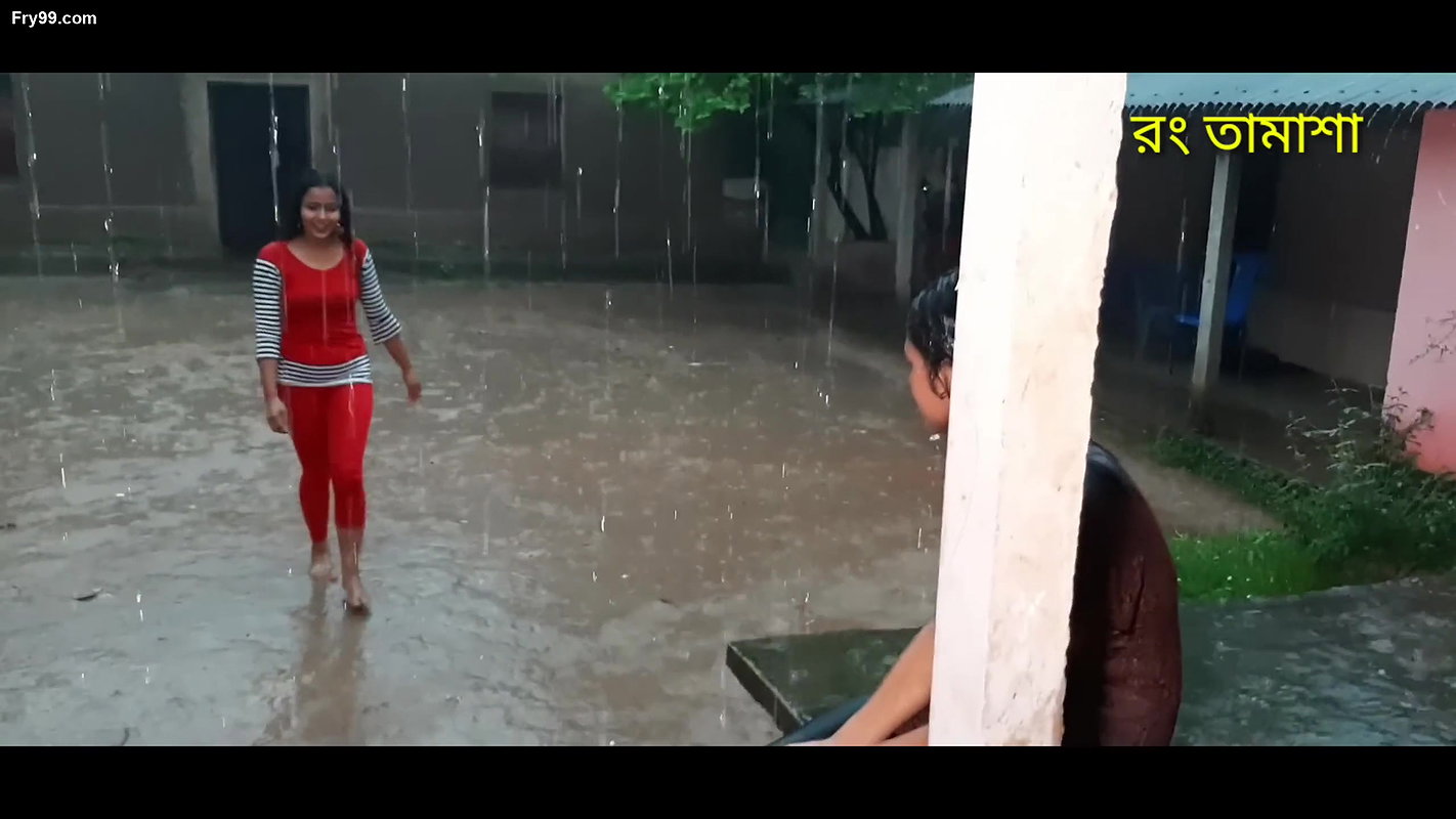 Two hot young girl enjoying in rain scene making