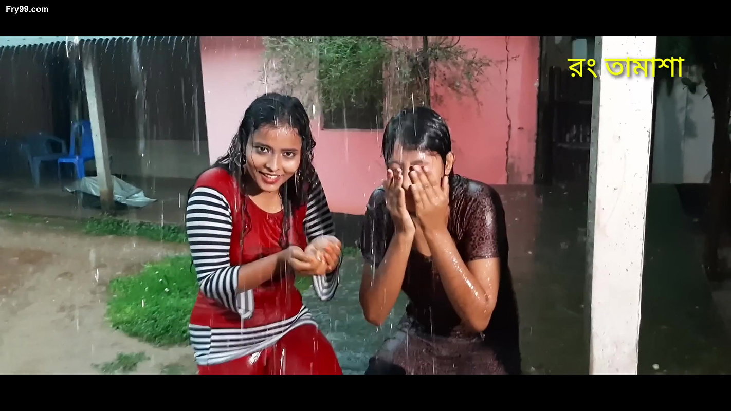 Two hot young girl enjoying in rain scene making