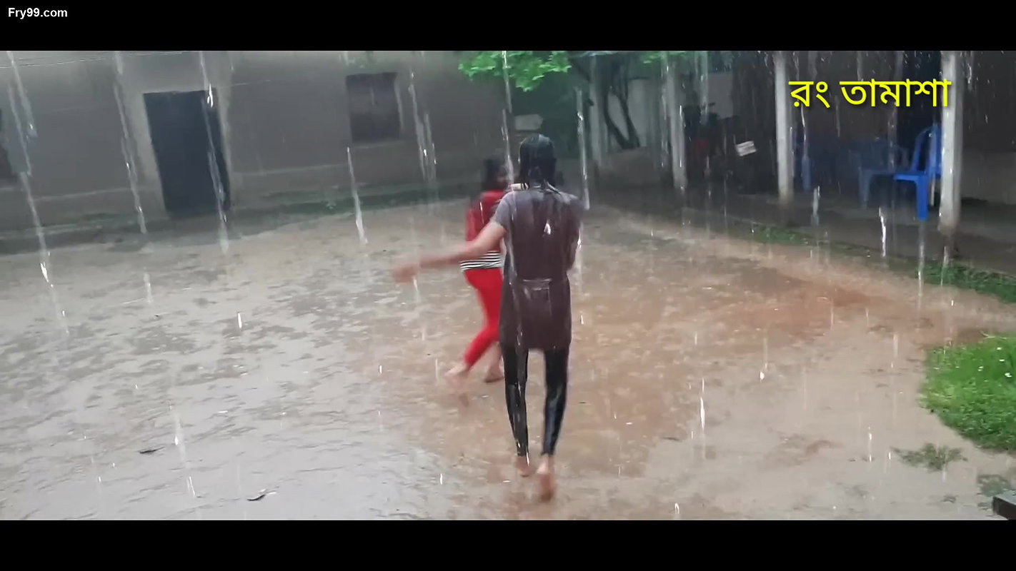 Two hot young girl enjoying in rain scene making