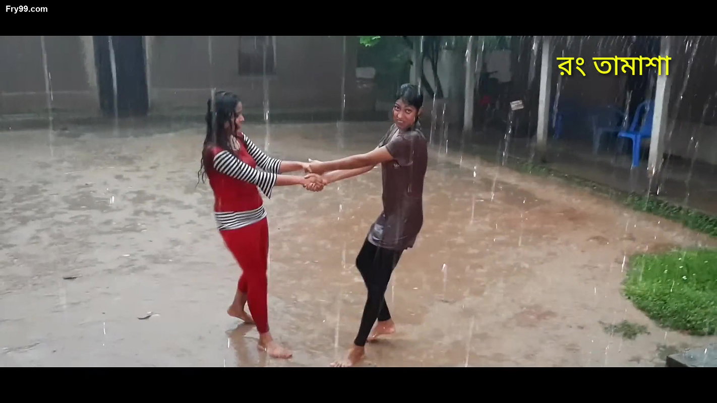 Two hot young girl enjoying in rain scene making