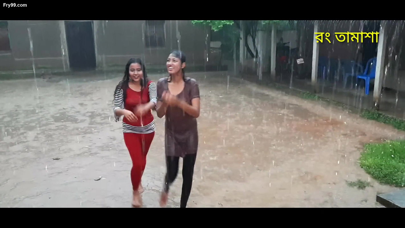 Two hot young girl enjoying in rain scene making