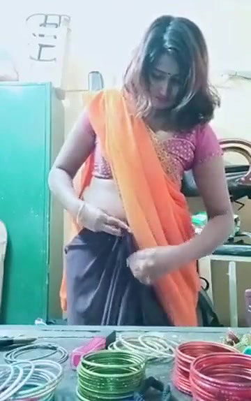 Swathi naidu sexy and romantic seducing in orange saree