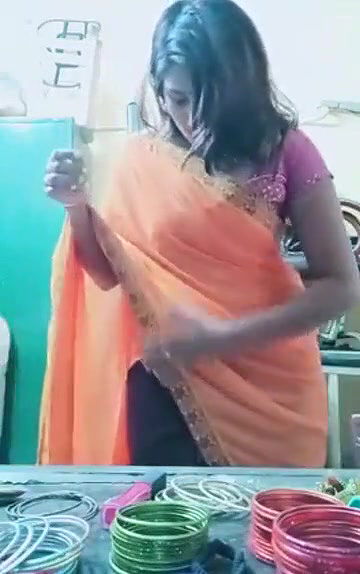 Swathi naidu sexy and romantic seducing in orange saree