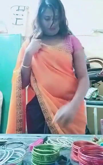 Swathi naidu sexy and romantic seducing in orange saree